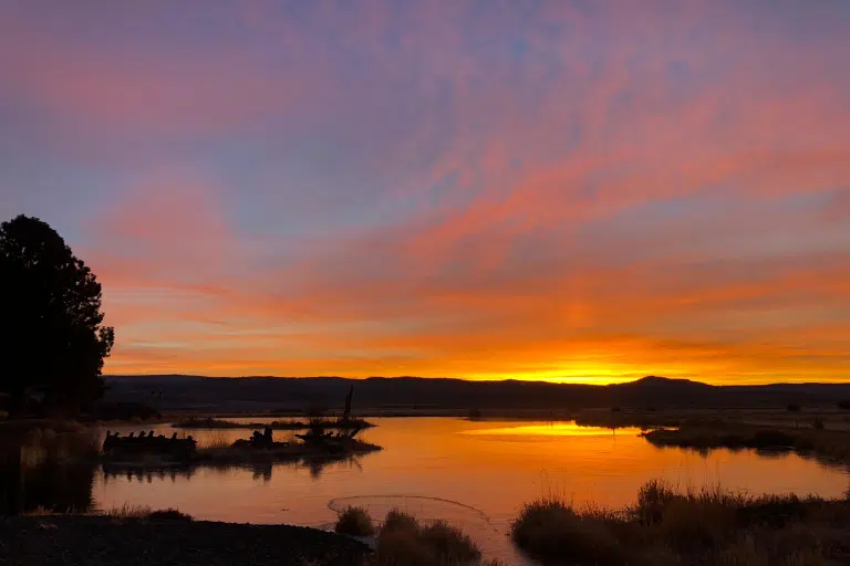 Sunset over a frozen lake in winter